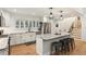 Modern kitchen with white cabinets, stainless steel appliances and hardwood floors at 5572 Sherrell Dr, Atlanta, GA 30342