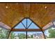 Covered patio features a wood ceiling with skylight and recessed lighting at 1095 Lanier Pl, Cumming, GA 30041