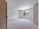 Spacious bedroom featuring a large window and door at 1095 Lanier Pl, Cumming, GA 30041