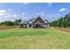 Modern farmhouse style home with backyard and covered patio at 1095 Lanier Pl, Cumming, GA 30041