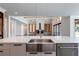 Modern kitchen with farmhouse sink, large island, and hardwood floors at 1095 Lanier Pl, Cumming, GA 30041