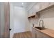 Bright laundry room with wood countertop and modern sink at 1095 Lanier Pl, Cumming, GA 30041