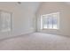 Spacious main bedroom with large window and carpeted floor at 1095 Lanier Pl, Cumming, GA 30041