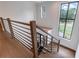 Elegant staircase with metal railing and hardwood steps, bright window at 1095 Lanier Pl, Cumming, GA 30041