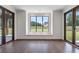 Sunroom with hardwood floors and a built-in window seat at 1095 Lanier Pl, Cumming, GA 30041