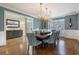 Formal dining room with a large wooden table and blue chairs at 1240 Woodlawn Ne Dr, Marietta, GA 30068