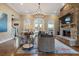 Living room with stone fireplace, hardwood floors, and large windows at 1240 Woodlawn Ne Dr, Marietta, GA 30068