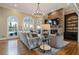 Living room with stone fireplace, hardwood floors, and a chandelier at 1240 Woodlawn Ne Dr, Marietta, GA 30068