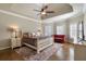 Spacious main bedroom with a king-size bed and neutral decor at 1240 Woodlawn Ne Dr, Marietta, GA 30068