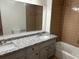 Bathroom with granite countertops and double sinks at 1737 Ramblewood Way, Snellville, GA 30078