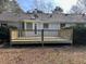 New deck with wood railings overlooking backyard at 1737 Ramblewood Way, Snellville, GA 30078