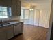 Kitchen dining area with vinyl flooring and built-in cabinets at 1737 Ramblewood Way, Snellville, GA 30078