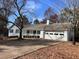 White brick ranch home with a spacious driveway and landscaping at 1737 Ramblewood Way, Snellville, GA 30078