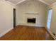 Living room with hardwood floors and a brick fireplace at 1737 Ramblewood Way, Snellville, GA 30078