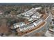 An aerial view of new construction homes and community pool with new paving in a neighborhood surrounded by mature trees at 3311 Cranston Ln, Kennesaw, GA 30144