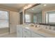 Double vanity bathroom with white cabinets and a large mirror at 3311 Cranston Ln, Kennesaw, GA 30144