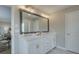 Double vanity bathroom with a large mirror and white cabinets at 3311 Cranston Ln, Kennesaw, GA 30144