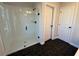 Bathroom with a large glass shower and dark hexagon tile floor at 3311 Cranston Ln, Kennesaw, GA 30144