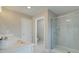 Double vanity bathroom with white cabinets and a large glass shower at 3311 Cranston Ln, Kennesaw, GA 30144