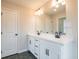 Double vanity bathroom with dark hexagon tile floor at 3311 Cranston Ln, Kennesaw, GA 30144