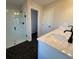 Bathroom with a large glass shower and dark hexagon tile floor at 3311 Cranston Ln, Kennesaw, GA 30144