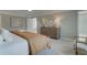 Bright bedroom with a dresser, large bed, and neutral color scheme at 3311 Cranston Ln, Kennesaw, GA 30144