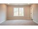 Spacious bedroom with carpeted floor and large window at 3311 Cranston Ln, Kennesaw, GA 30144