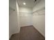 Large walk-in closet with wire shelving and neutral carpeting at 3311 Cranston Ln, Kennesaw, GA 30144