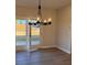 Bright dining room with chandelier and French doors leading to backyard at 3311 Cranston Ln, Kennesaw, GA 30144