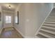 Bright entryway with stairs and neutral color palette at 3311 Cranston Ln, Kennesaw, GA 30144