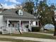 White house with a porch, white railings and ice cream signage at 3311 Cranston Ln, Kennesaw, GA 30144