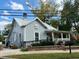 Charming exterior view of a gray clapboard house with a metal roof, a front porch, and manicured landscaping at 3311 Cranston Ln, Kennesaw, GA 30144