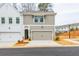 Two-story townhome with attached garage and neutral color palette at 3311 Cranston Ln, Kennesaw, GA 30144