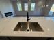 Modern kitchen with stainless steel sink and quartz countertop at 3311 Cranston Ln, Kennesaw, GA 30144