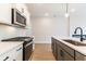 Modern kitchen with stainless steel appliances and white shaker cabinets at 3311 Cranston Ln, Kennesaw, GA 30144