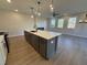 Kitchen island with white quartz countertop and gray cabinets at 3311 Cranston Ln, Kennesaw, GA 30144