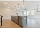 Modern kitchen island with stainless steel appliances and light gray cabinets at 3311 Cranston Ln, Kennesaw, GA 30144