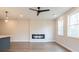 Spacious living room with electric fireplace and ceiling fan at 3311 Cranston Ln, Kennesaw, GA 30144