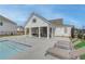 A pool house with ceiling fans, table and chairs and lounge chairs outside for relaxing by the pool at 3311 Cranston Ln, Kennesaw, GA 30144