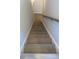 Modern staircase with light gray wood treads and white risers at 3311 Cranston Ln, Kennesaw, GA 30144