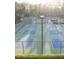 A bright shot showcases the community's well-maintained tennis courts at 237 Laurel Vista Dr, Canton, GA 30114