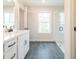 Bathroom with double vanity, walk-in shower, and grey tile floor at 3305 Cranston Ln, Kennesaw, GA 30144