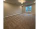 Spacious bedroom with neutral carpeting and large window at 3305 Cranston Ln, Kennesaw, GA 30144