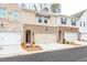 Brick townhome exterior with attached garage and landscaping at 3305 Cranston Ln, Kennesaw, GA 30144