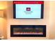 Modern electric fireplace with tv above at 3305 Cranston Ln, Kennesaw, GA 30144