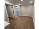 Bright hallway with wood flooring and access to other rooms at 3305 Cranston Ln, Kennesaw, GA 30144