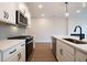 Modern kitchen with stainless steel appliances and white cabinets at 3305 Cranston Ln, Kennesaw, GA 30144