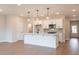 Modern kitchen with white cabinets, quartz counters, and island at 3305 Cranston Ln, Kennesaw, GA 30144