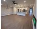 Open living area with kitchen and fireplace at 3305 Cranston Ln, Kennesaw, GA 30144