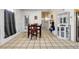 Small dining area with tile floor, wooden table and chairs, and white cabinet at 5392 Brickleberry Way, Douglasville, GA 30134